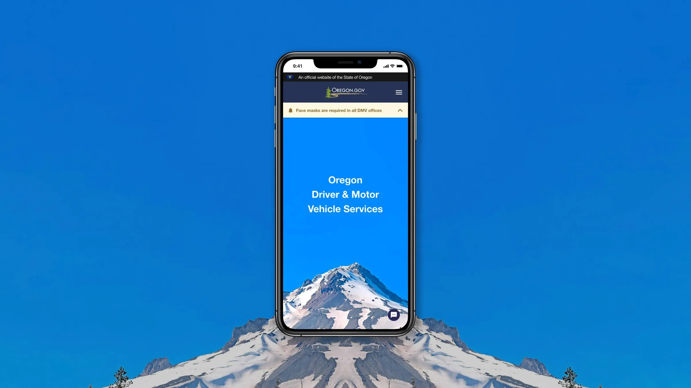 The redesigned Oregon DMV mobile site on a phone, showing the state government masthead, a face covering advisory, and a Driver and Motor Vehicle Services headline over Mount Hood